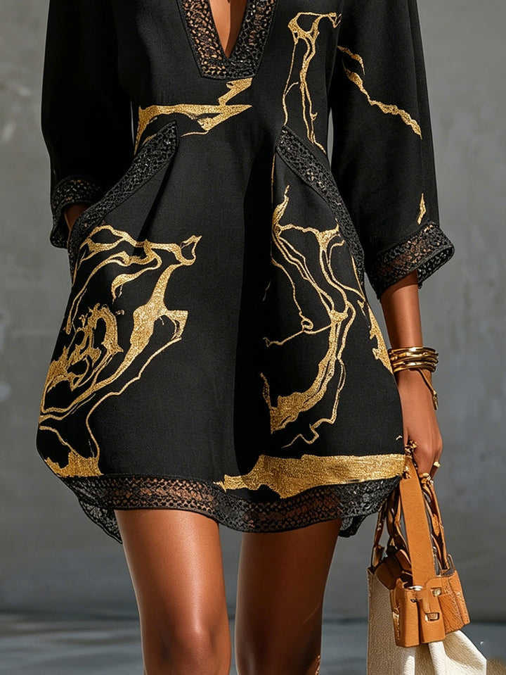 Ébène | Minivestido con escote en V y estampado negro y dorado